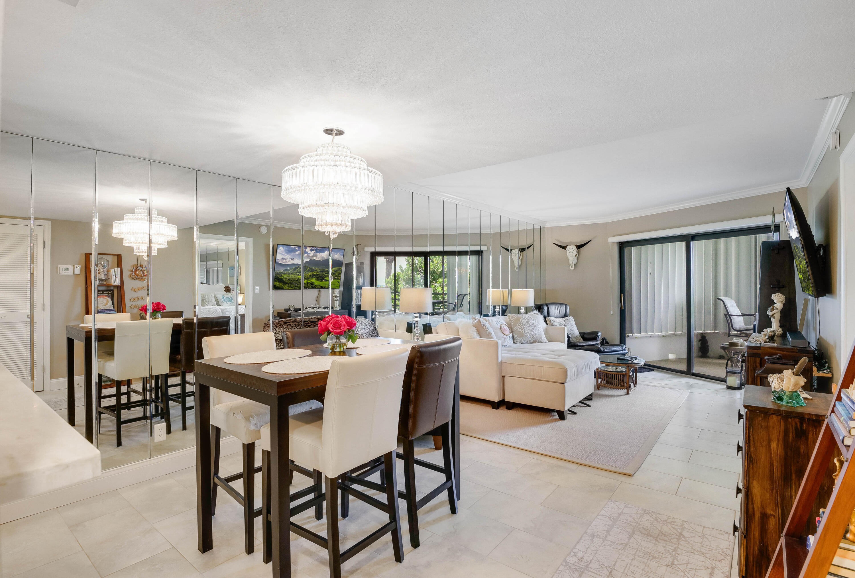 420 Celestial Way, Unit 204 Juno Beach, FL 33408 - Photo 6 of 35 a view of a dining room with furniture and a chandelier