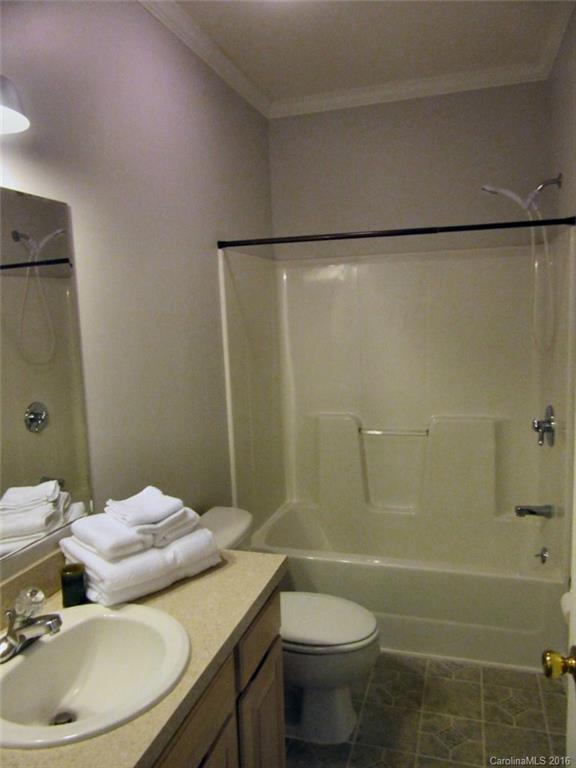 115 Coltons Way, Unit 2 Penrose, NC 28766 - Photo 12 of 14 a bathroom with a mirror and a shower