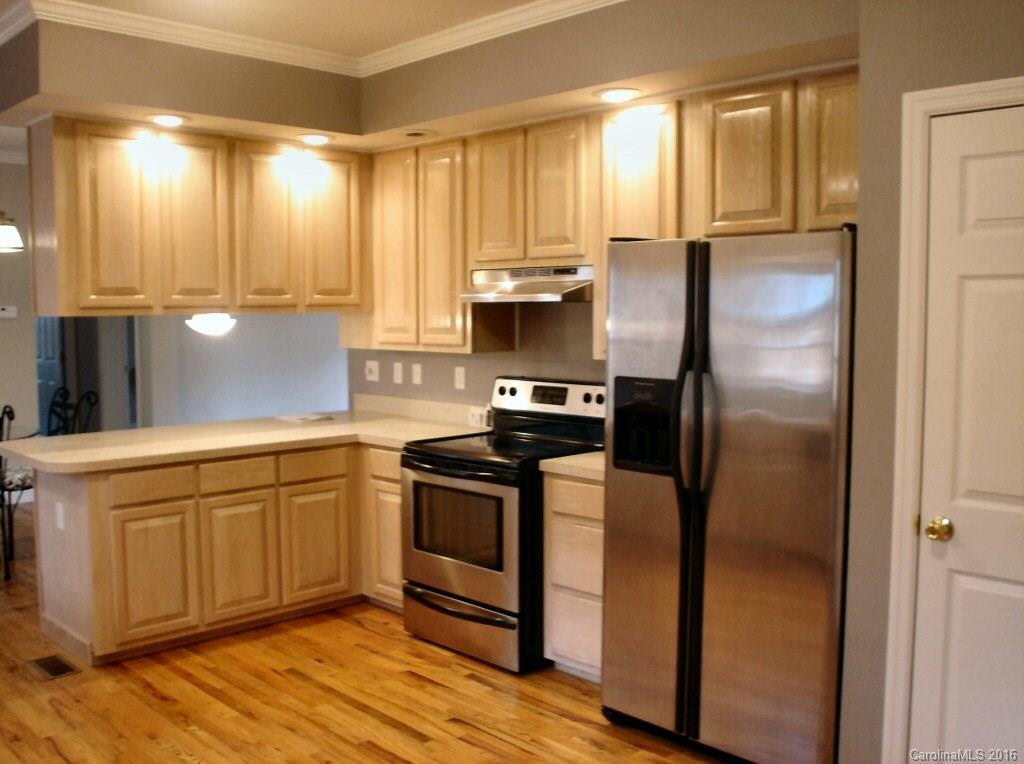 115 Coltons Way, Unit 2 Penrose, NC 28766 - Photo 6 of 14 a kitchen with stainless steel appliances granite countertop a refrigerator a sink and a stove