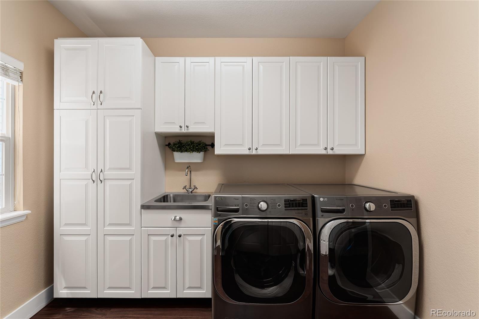 9441 South Hackberry Lane Highlands Ranch, CO 80129 - Photo 26 of 50 a view of a storage and utility room with washer and dryer