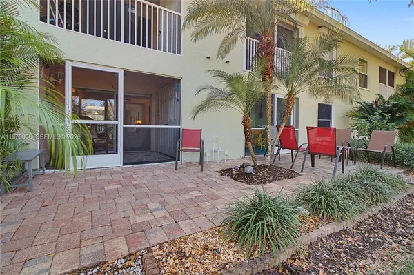 a view of a building with potted plants