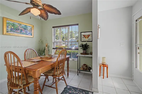 a dining room with furniture and window