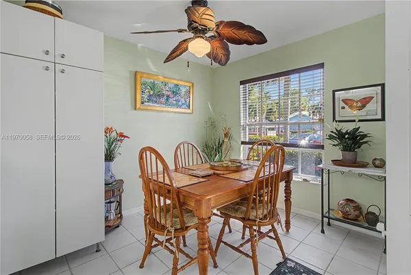 a dining room with furniture and window