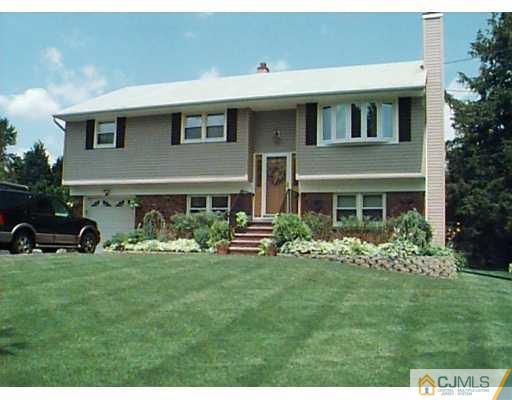 55 Ellison Road Somerset, NJ 08873 - Photo 1 of 8 a front view of a house with a garden