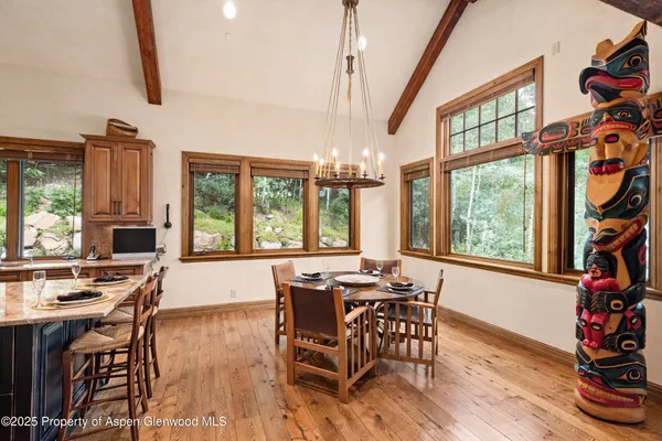a view of a dining room with furniture window and outside view