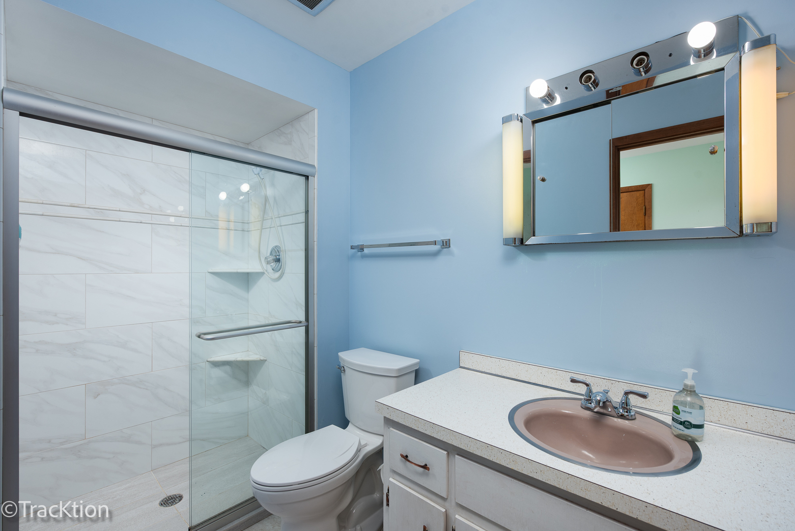 249 Surrey Road Bartlett, IL 60103 - Photo 16 of 28 a bathroom with a sink a toilet and shower