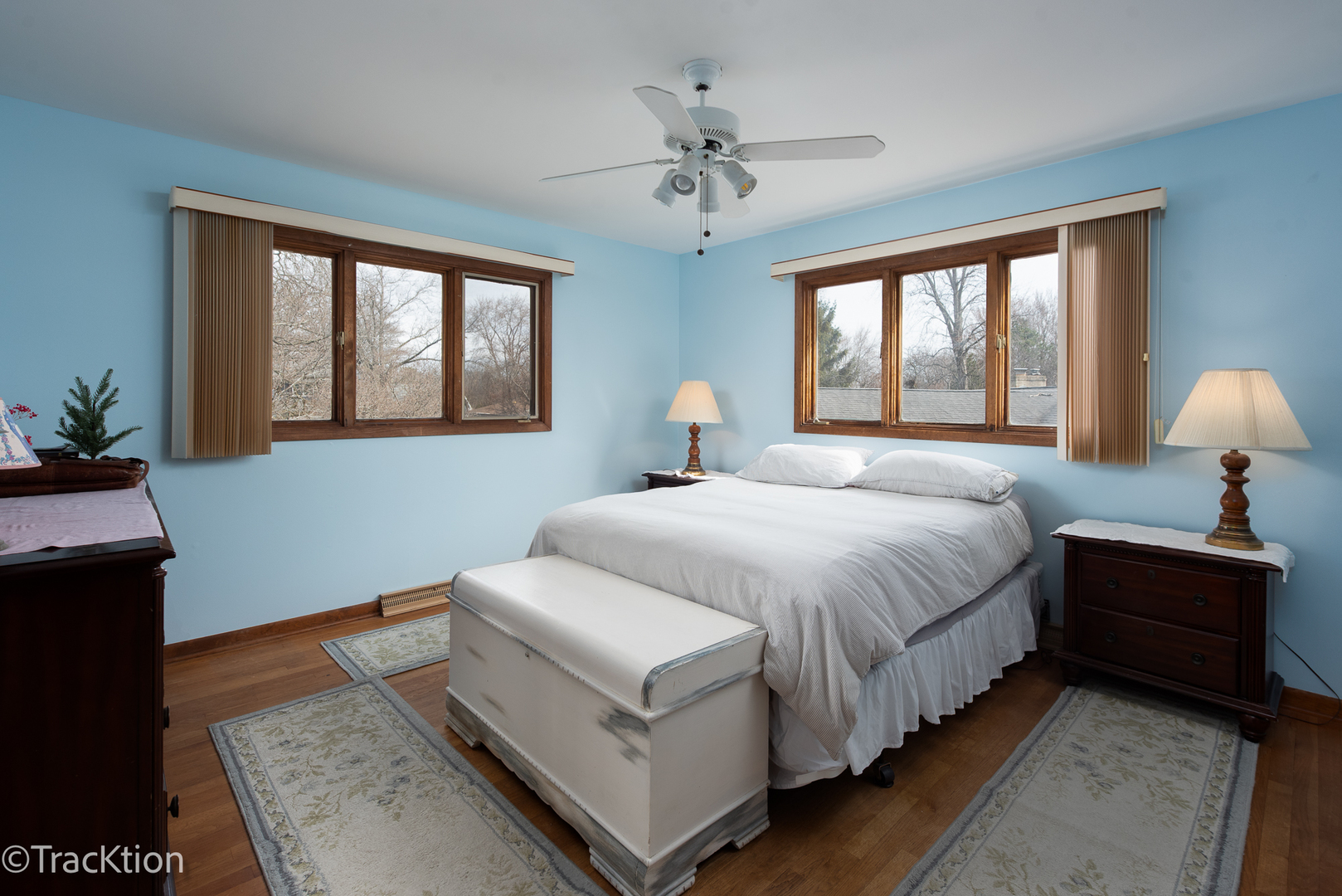 249 Surrey Road Bartlett, IL 60103 - Photo 17 of 28 a spacious bedroom with a bed and a chandelier