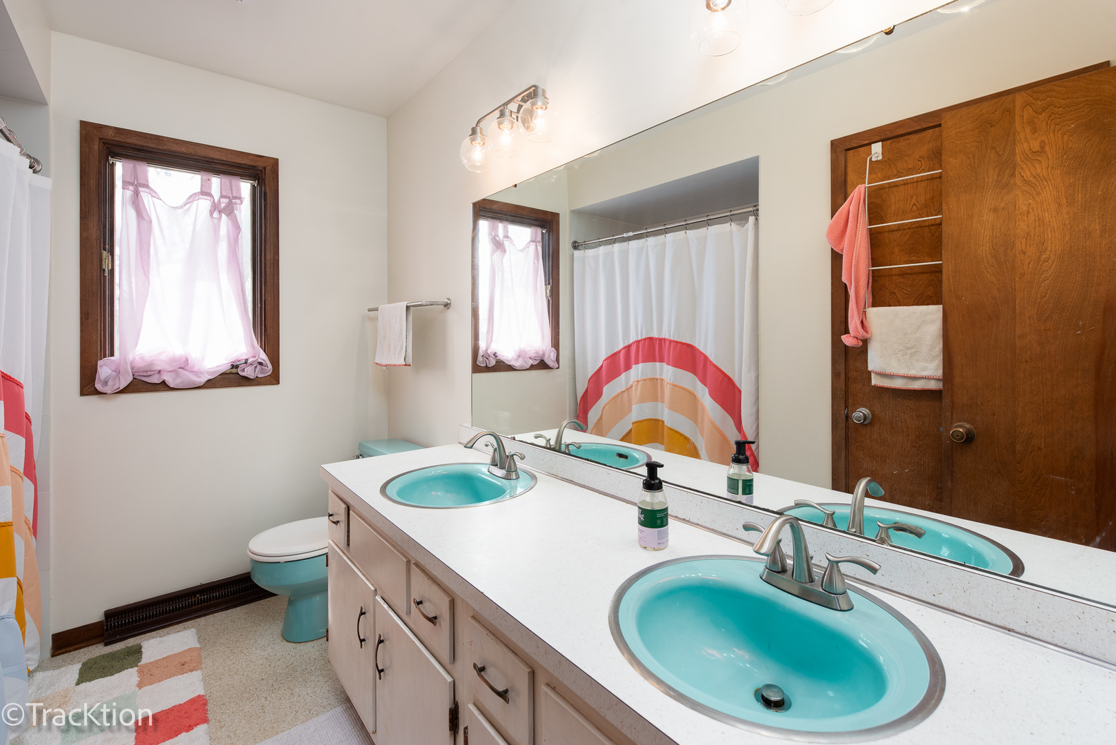 249 Surrey Road Bartlett, IL 60103 - Photo 18 of 28 a bathroom with a sink and a mirror