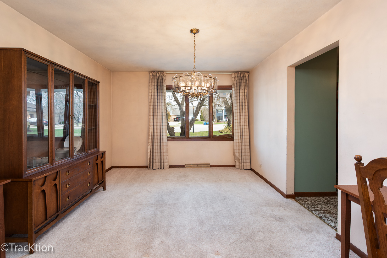 249 Surrey Road Bartlett, IL 60103 - Photo 3 of 28 a view of a room with window and chandelier