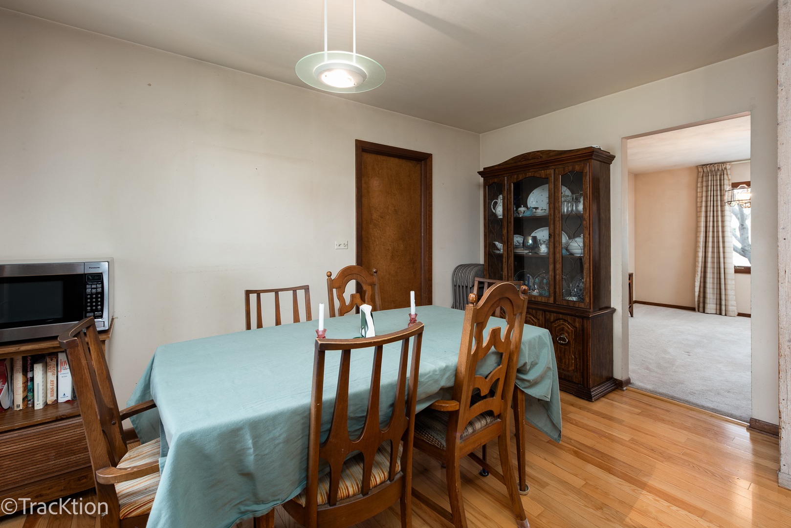 249 Surrey Road Bartlett, IL 60103 - Photo 4 of 28 a view of a dining room with furniture and a book shelf