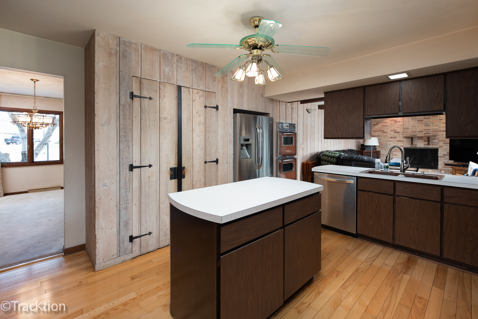 249 Surrey Road Bartlett, IL 60103 - Photo 6 of 28 a kitchen with a sink a refrigerator and cabinets