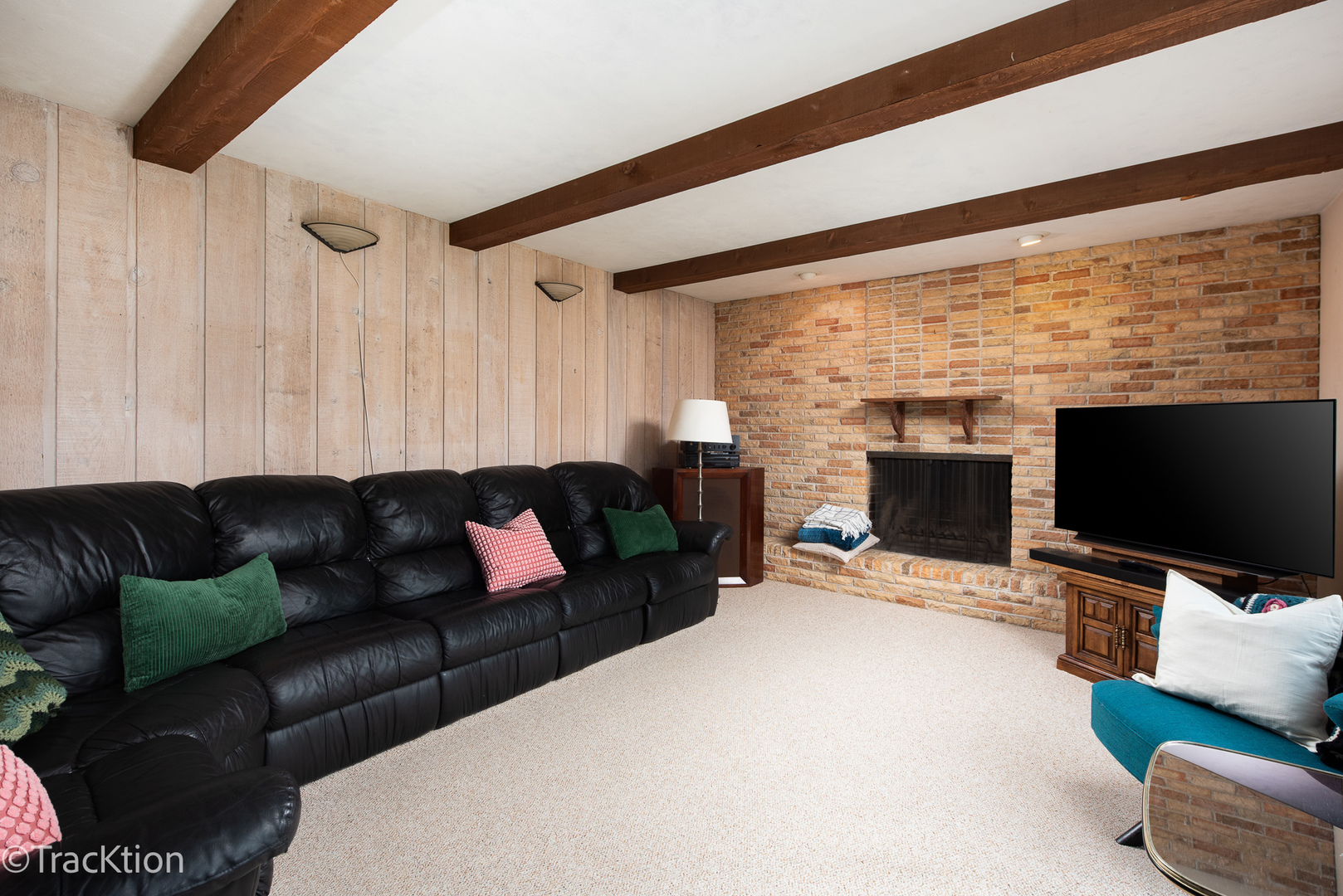 249 Surrey Road Bartlett, IL 60103 - Photo 8 of 28 a living room with furniture a flat screen tv and a fireplace