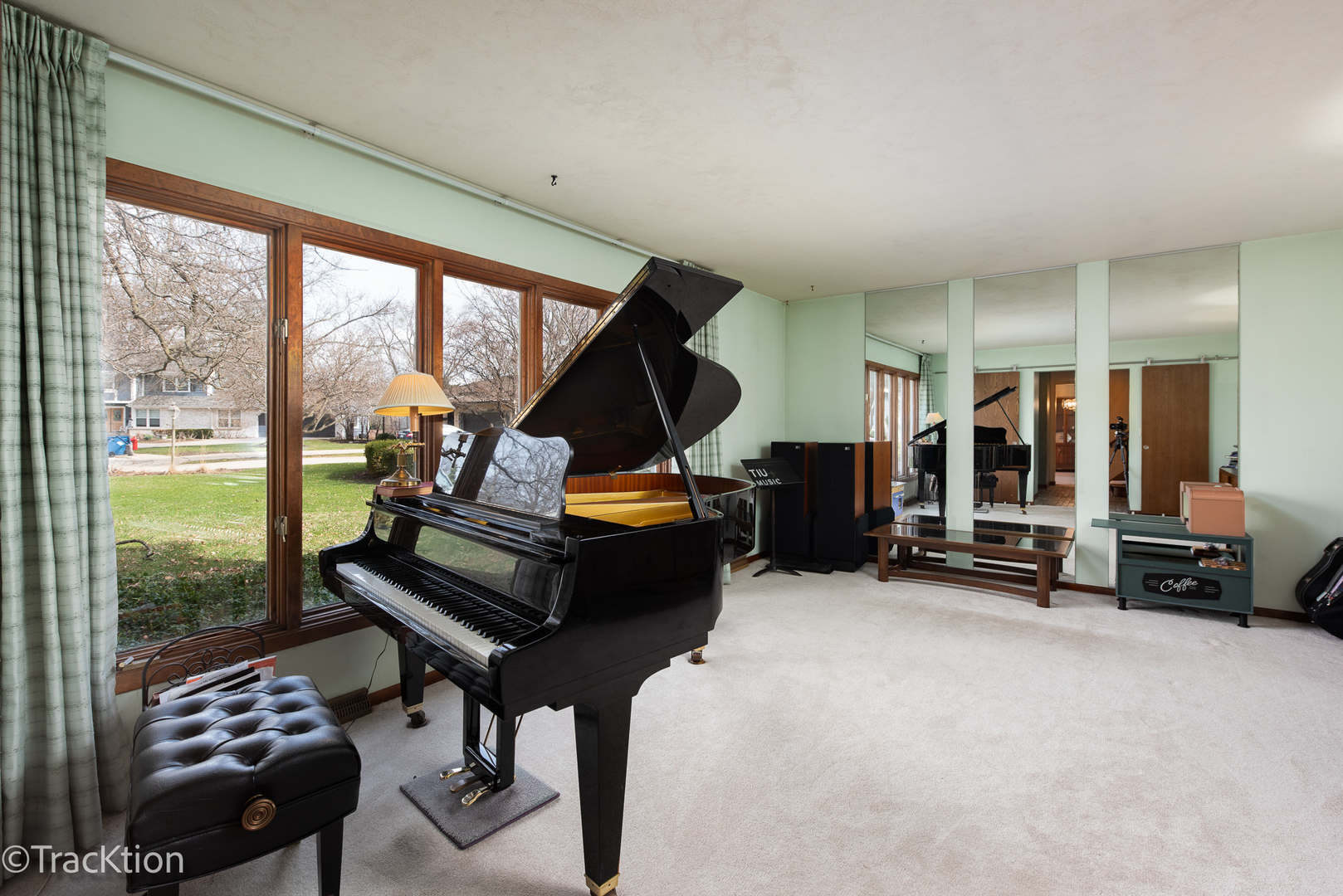 249 Surrey Road Bartlett, IL 60103 - Photo 9 of 28 a living room with furniture and a floor to ceiling window