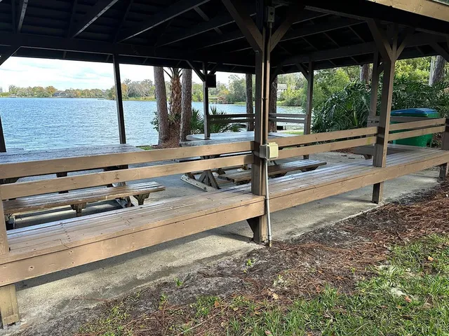 a view of a two chairs and an umbrella in the patio