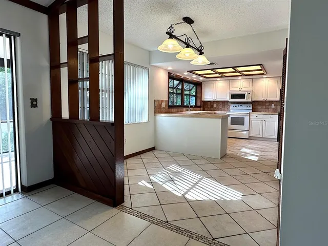 a view of kitchen and windows