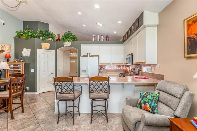 a kitchen with a table and chairs