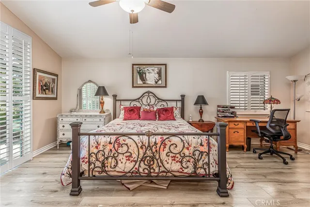 a bedroom with furniture and window