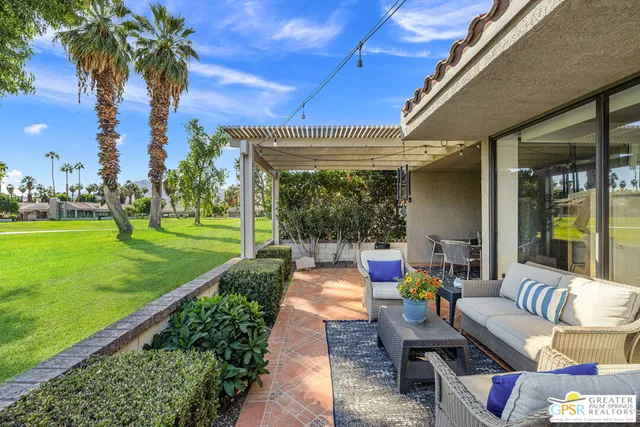 a view of yard with patio