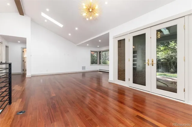 a kitchen with kitchen island a sink stainless steel appliances and cabinets