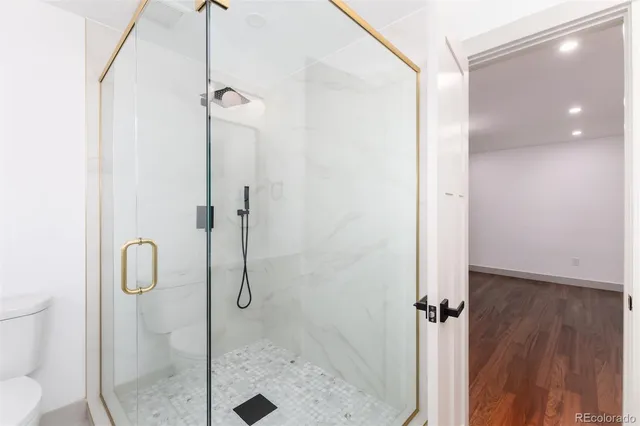 a utility room with a sink and mirror