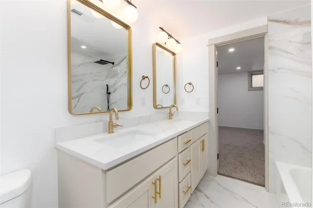 an empty room with windows and painted walls