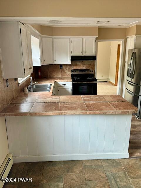 164 Tuthill Road Waymart, PA 18472 - Photo 14 of 33 a kitchen with kitchen island granite countertop a sink a stove top oven a counter space and cabinets