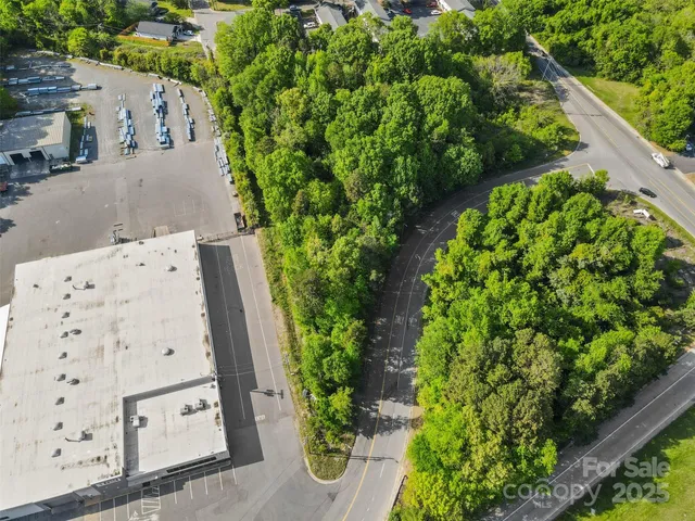 an aerial view of a house with a yard and garden