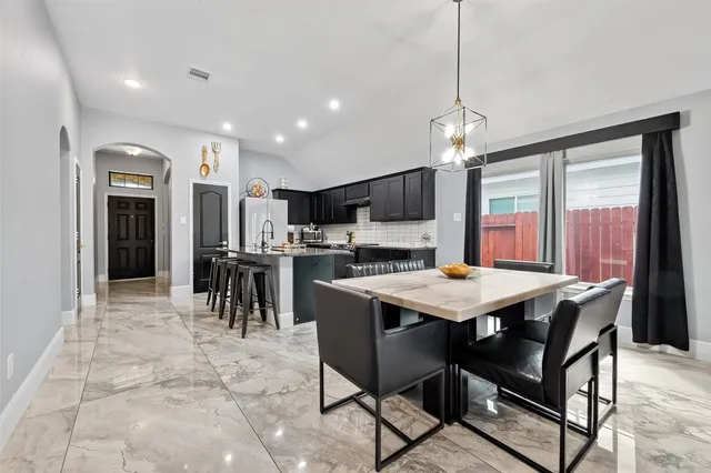 a view of a dining room with furniture