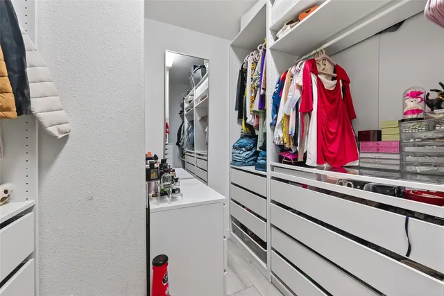 a view of a closet with storage