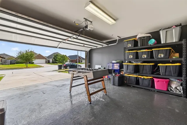 a reading room with furniture and a book shelf