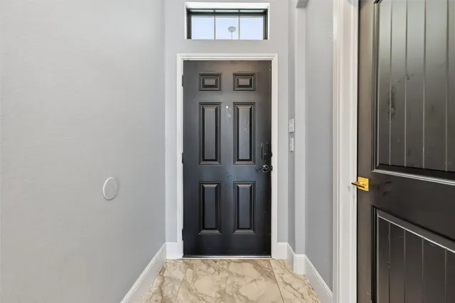 a view of a hallway with a wooden floor