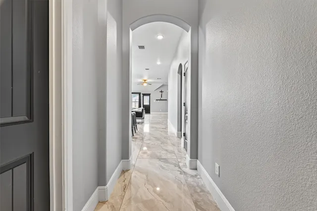 a view of a glass door and a living room