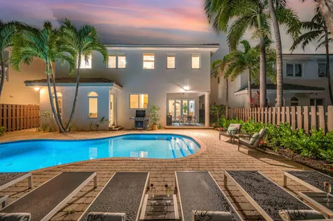 a view of a swimming pool with a patio