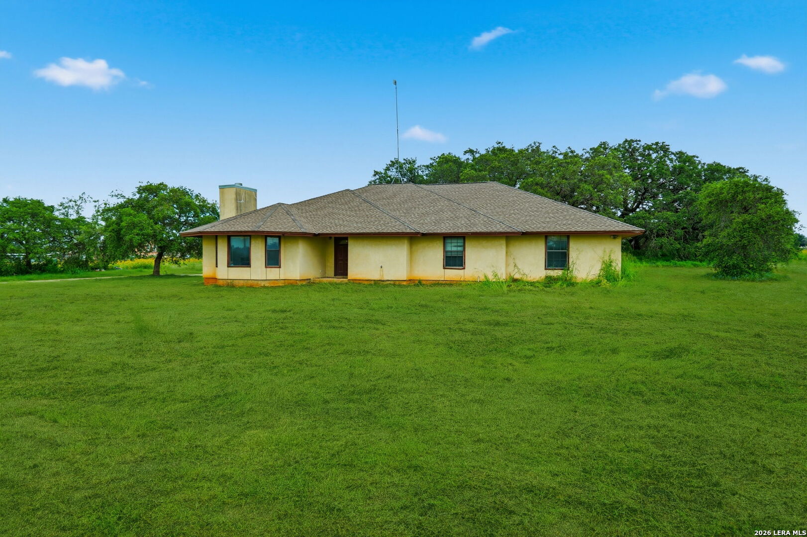 3061 Horse Ranch Road San Antonio, TX 78264 - Photo 3 of 34 a front view of a house with a garden