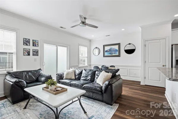 a living room with furniture rug and window