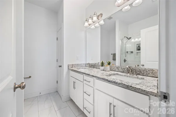 a bedroom with bed and tv