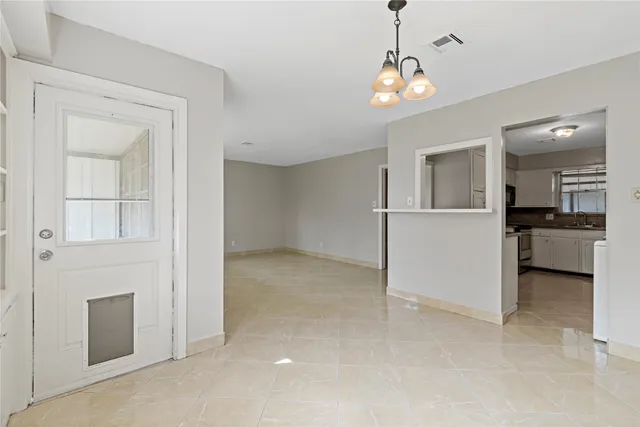 a view of a kitchen with a sink and dishwasher kitchen view with wooden floor