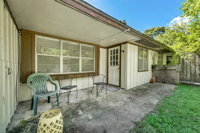 a house view with a outdoor seating