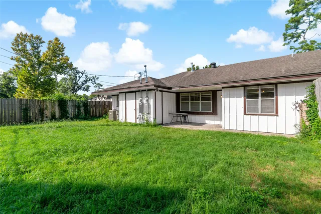 a view of a house with yard and a garden