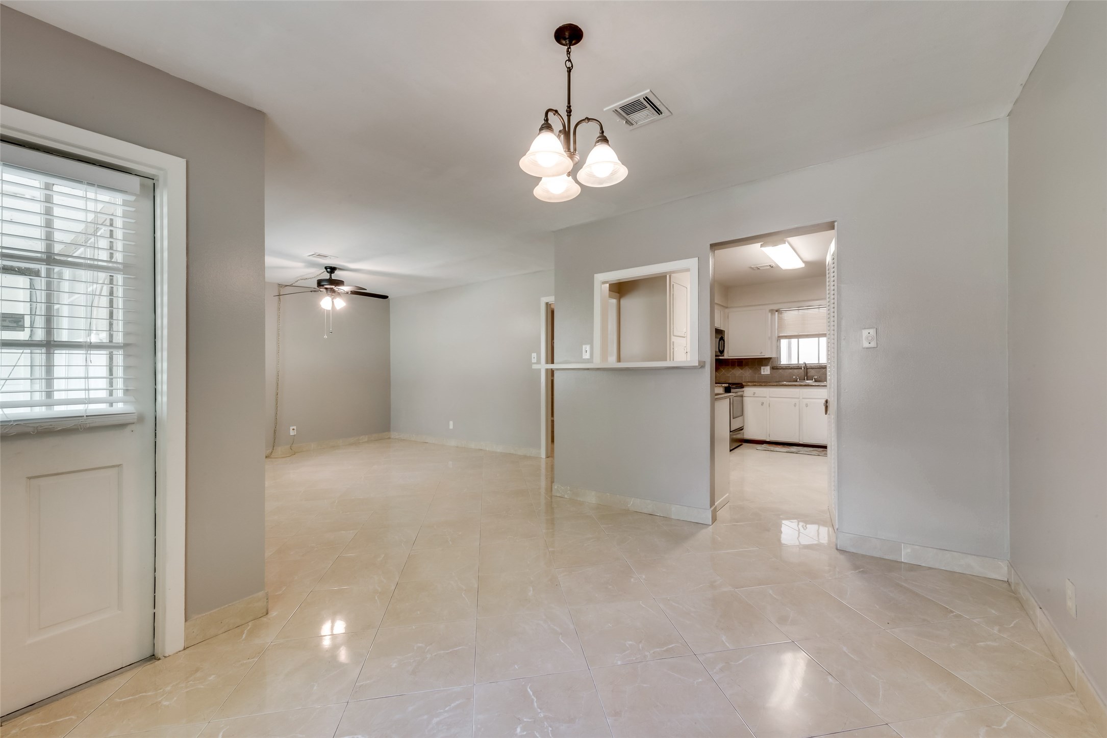1522 Baggett Lane, Unit A Houston, TX 77055 - Photo 10 of 29 a view of a kitchen and a sink cabinet cabinet and a living room