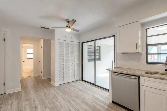 a area with wooden floor and window