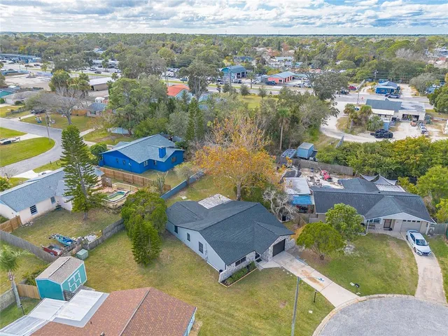 an aerial view of residential houses with outdoor space