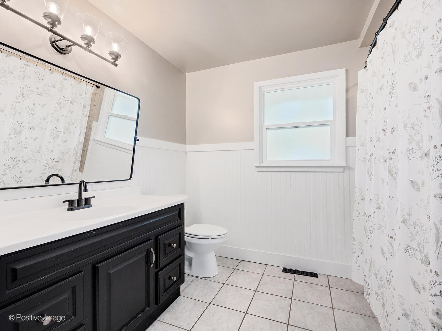 2 Sunset Lane Algonquin, IL 60102 - Photo 11 of 18 a bathroom with a sink a toilet a mirror and vanity