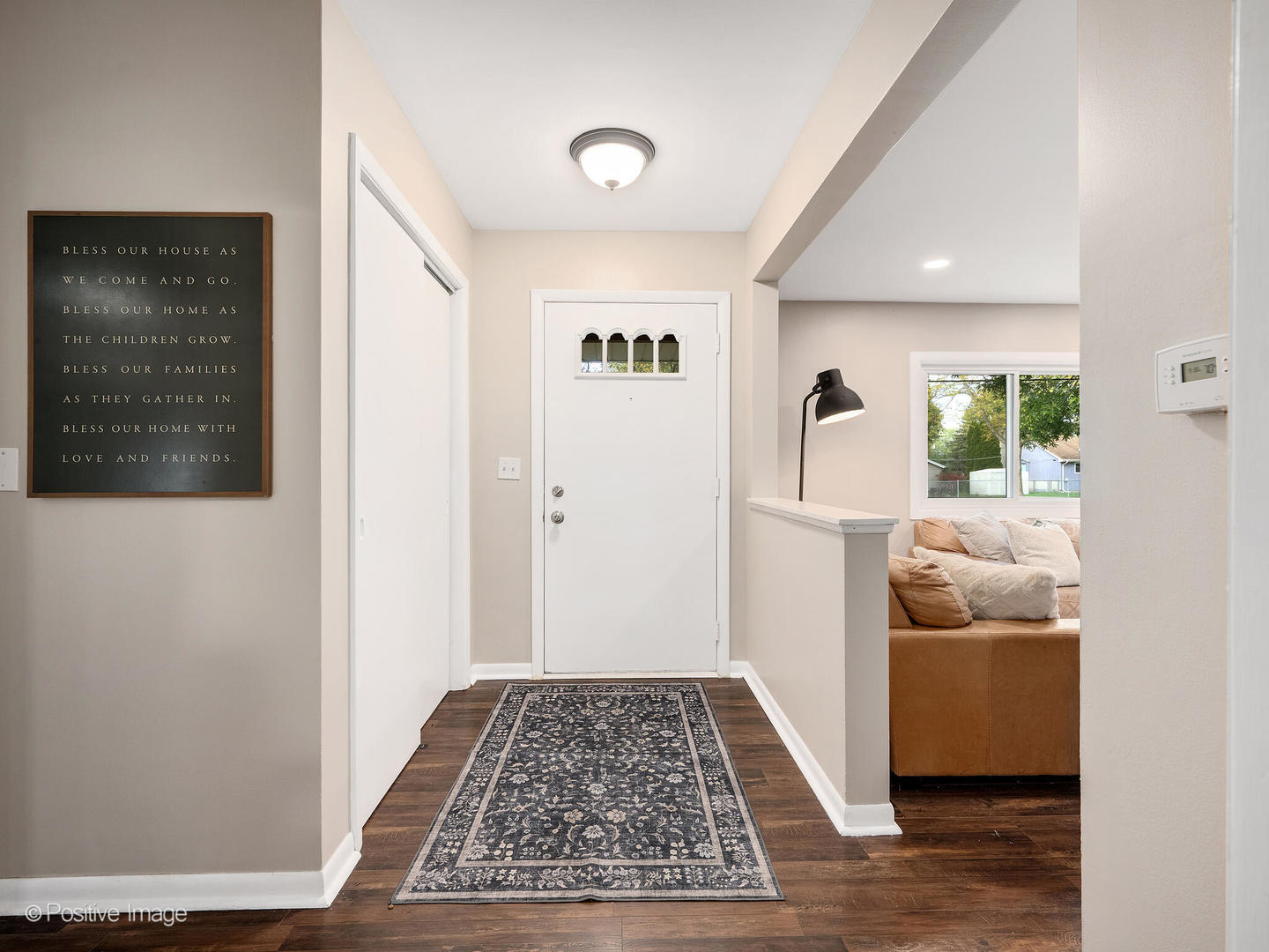 2 Sunset Lane Algonquin, IL 60102 - Photo 3 of 18 a view of a hallway and a livingroom with a couch