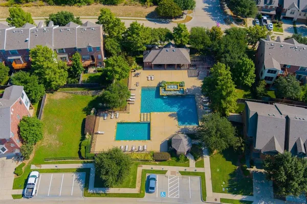 an aerial view of a house with a garden and a yard