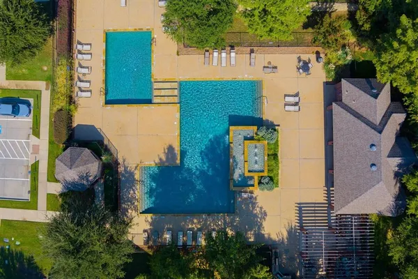 aerial view of a house with garden space and street view