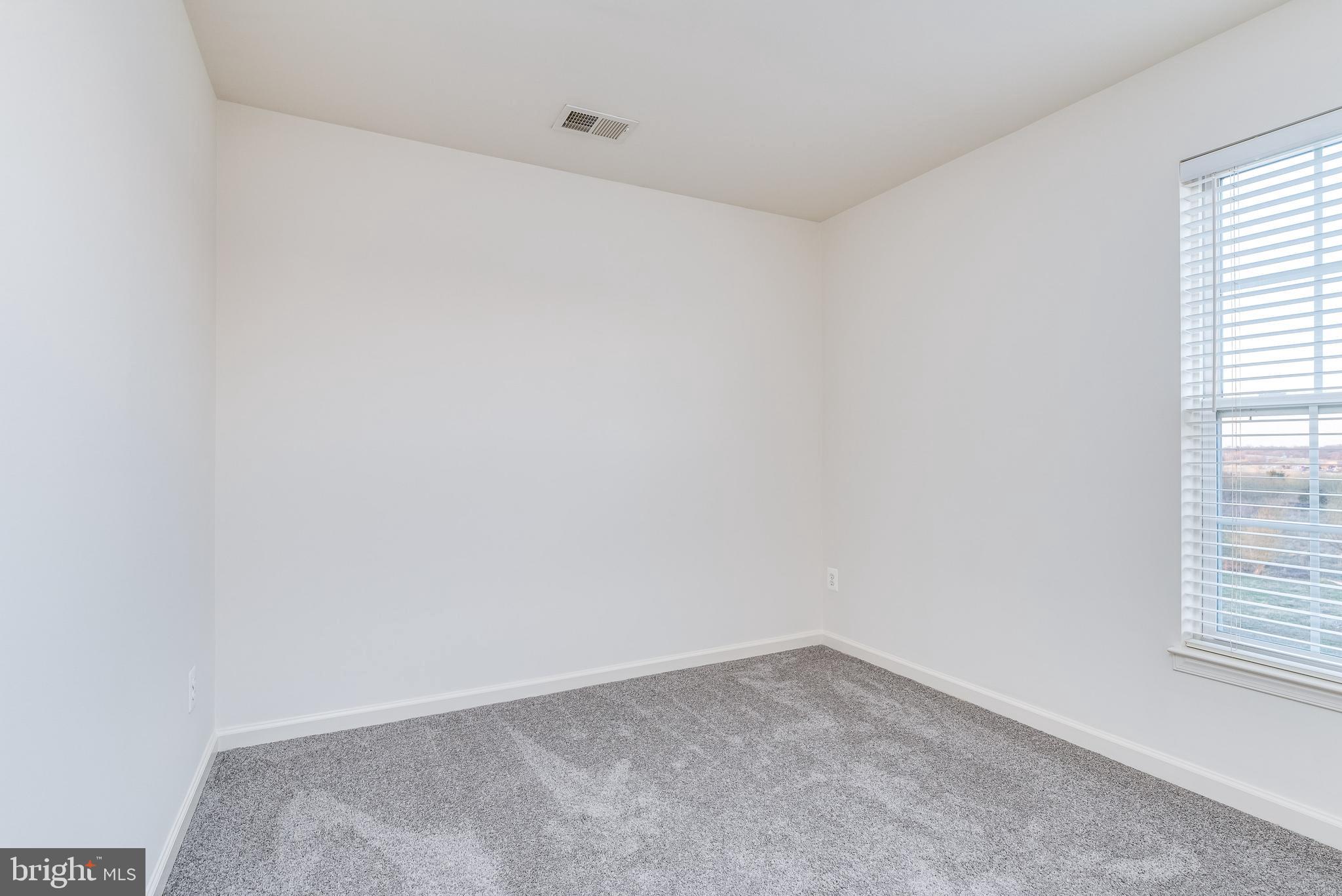 1357 North Fairfax Boulevard Ranson, WV 25438 - Photo 30 of 51 Bedroom 2 with carpet and natural light