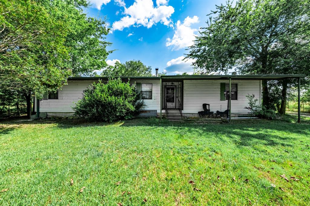 a front view of house with yard