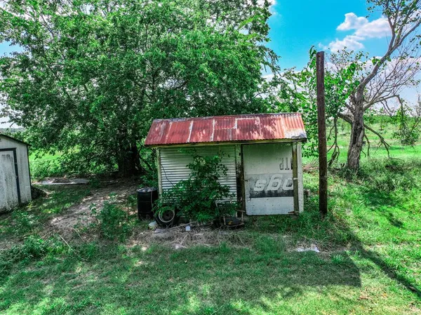 a view of a table and chairs in the yard