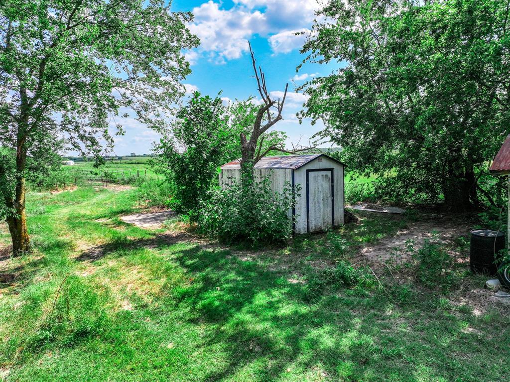 7801 West Interstate Highway Cumby, TX 75433 - Photo 12 of 31 a backyard of a house with lots of green space